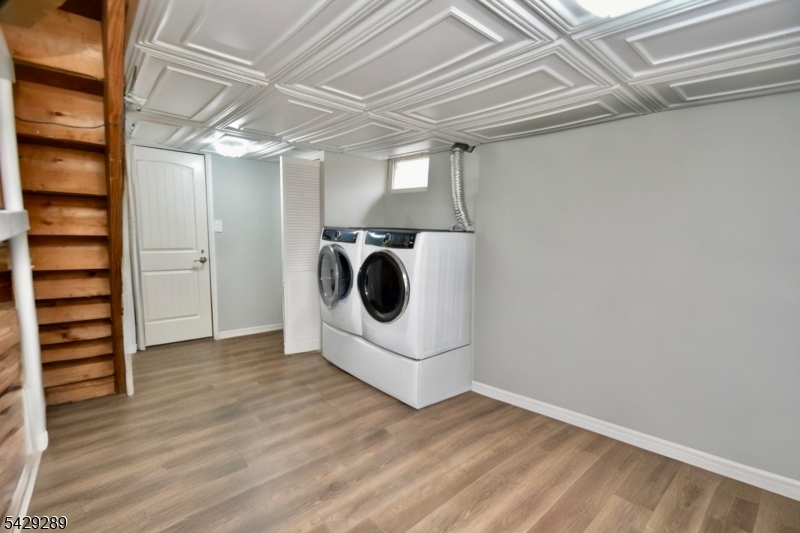 16 Pequot Trail Oak Ridge, NJ 07438 - Photo 14 of 18 a view of a storage & utility room with wooden floor