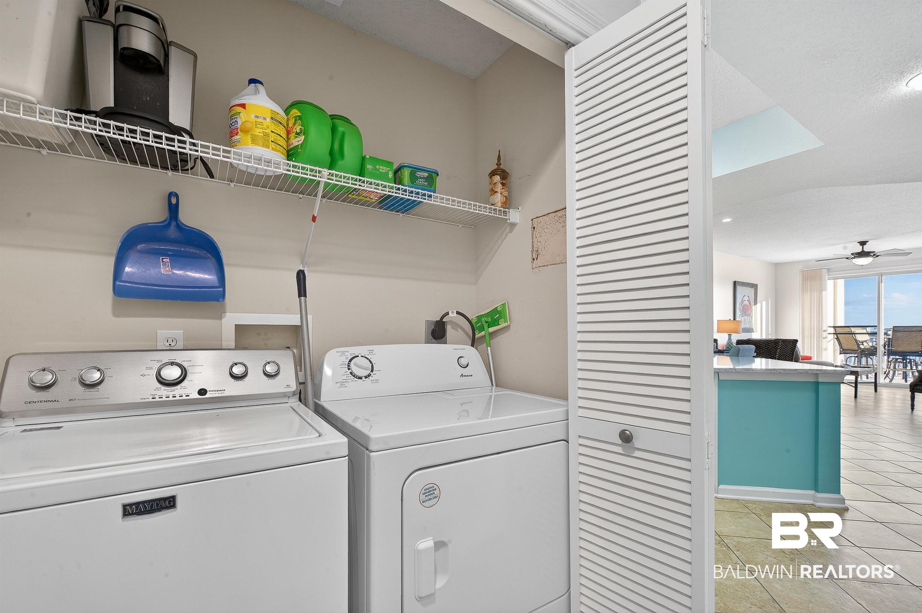 27282 Canal Road, Unit 408 Orange Beach, AL 36561 - Photo 21 of 37 Laundry room with washer and clothes dryer