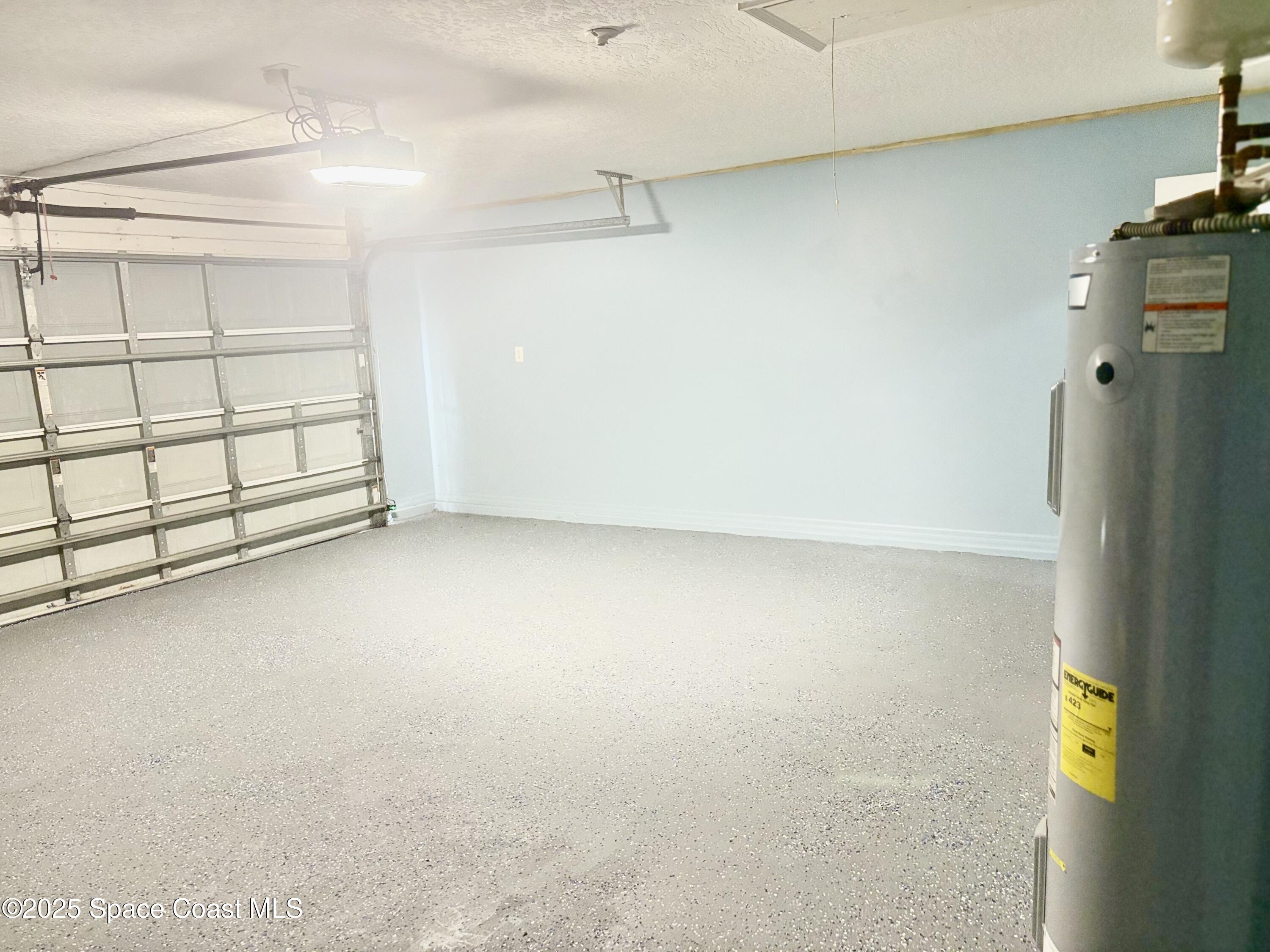 704 Cavio Avenue Northeast Palm Bay, FL 32905 - Photo 3 of 17 a view of a garage