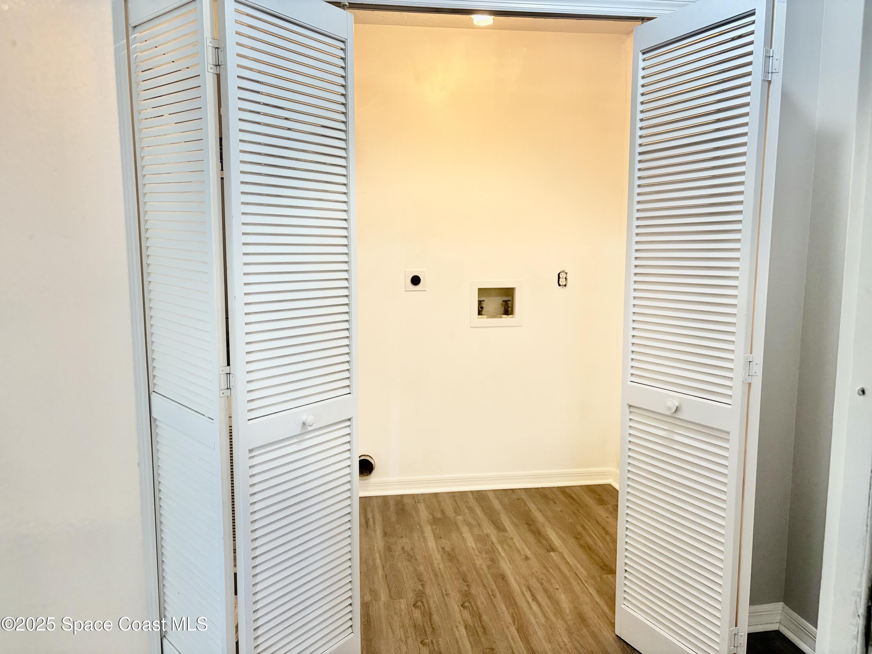 704 Cavio Avenue Northeast Palm Bay, FL 32905 - Photo 8 of 17 a view of a room that has a window in it