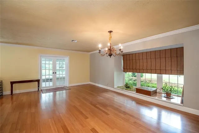 a view of livingroom with floor to ceiling window and wooden floor