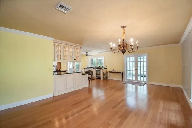 a view of an entryway with wooden floor and windows