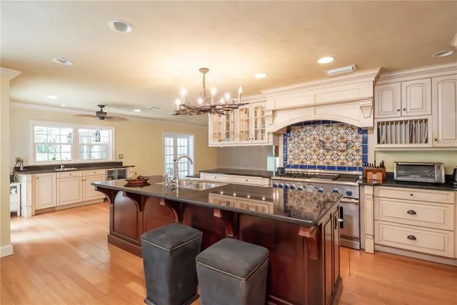 a view of a big room with closet and chandelier fan