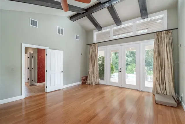 a bathroom with a sink and mirror with shower curtain
