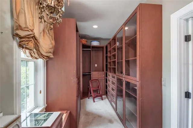 a view of a house with swimming pool and sitting area