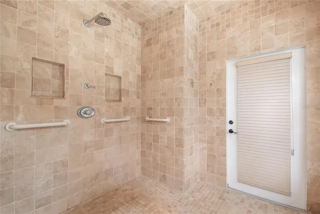 a front view of a house with yard and green space