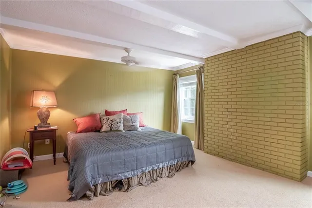 a backyard of a house with lots of green space and chair