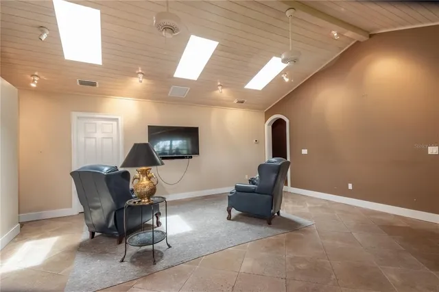 a view of a swimming pool with a yard