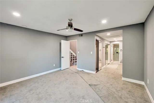 a bathroom with a glass door shower a sink and a mirror