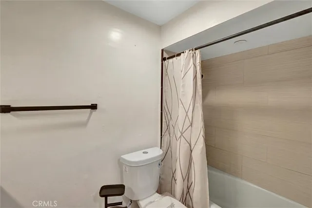 a view of a balcony with wooden floor