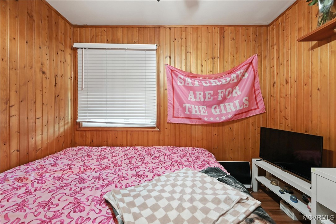 1593 Baxter Road Prince George, VA 23875 - Photo 14 of 48 a bedroom with a bed and a flat screen tv