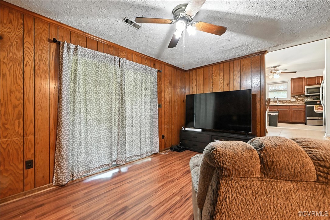 1593 Baxter Road Prince George, VA 23875 - Photo 16 of 48 a bedroom with bed and flat screen tv