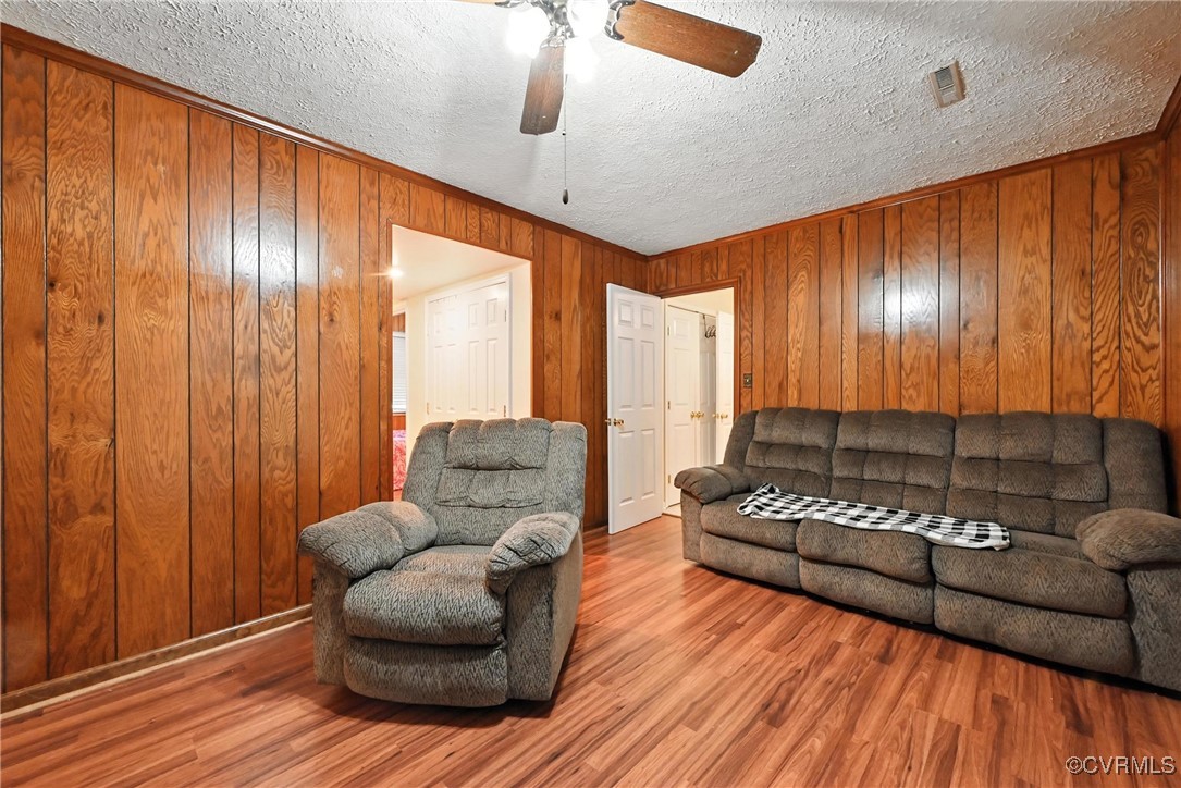 1593 Baxter Road Prince George, VA 23875 - Photo 17 of 48 a living room with furniture and wooden floor