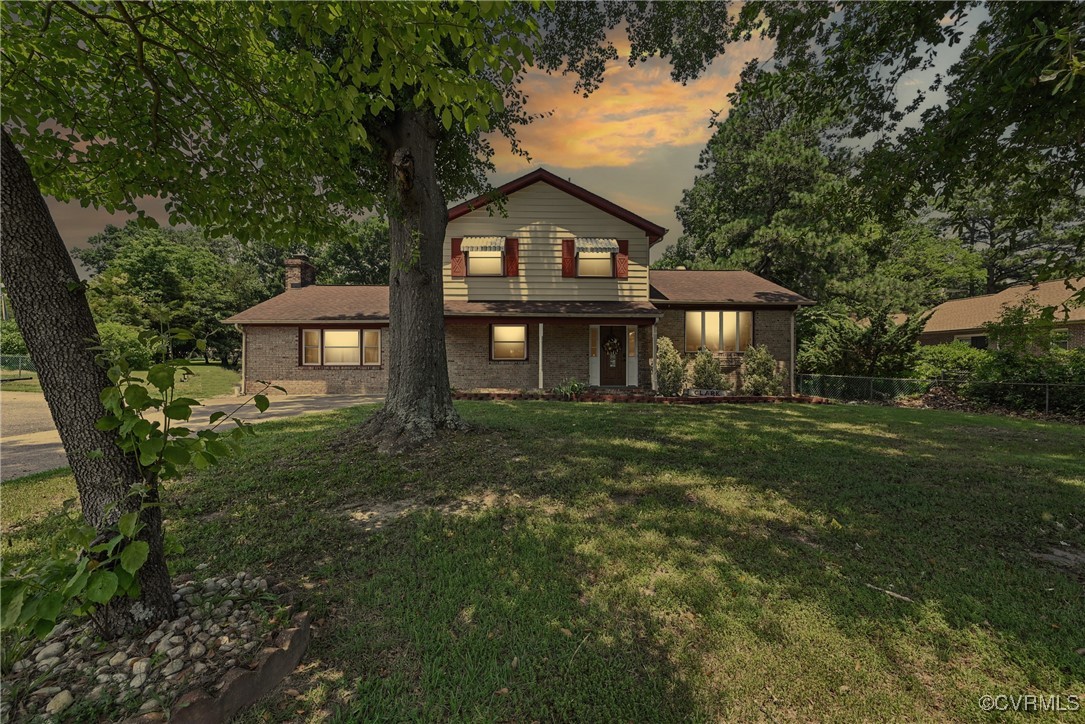 1593 Baxter Road Prince George, VA 23875 - Photo 2 of 48 a front view of a house with a garden