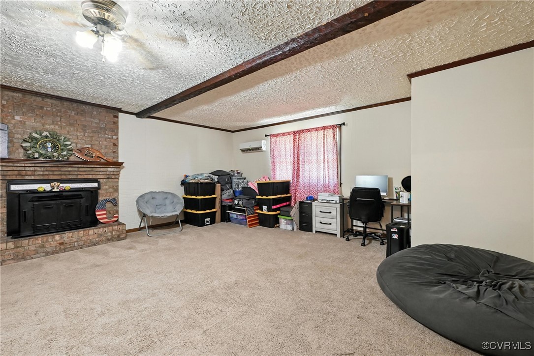 1593 Baxter Road Prince George, VA 23875 - Photo 21 of 48 a living room with furniture and a fireplace
