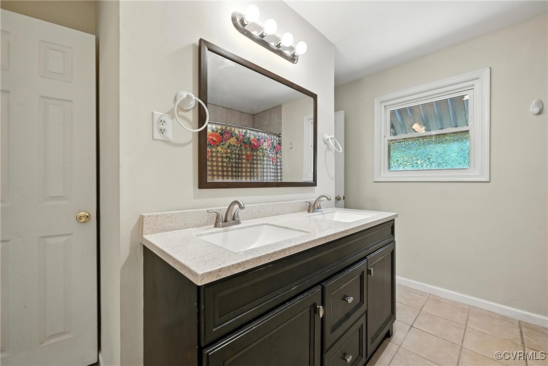 1593 Baxter Road Prince George, VA 23875 - Photo 23 of 48 a bathroom with a sink and a mirror