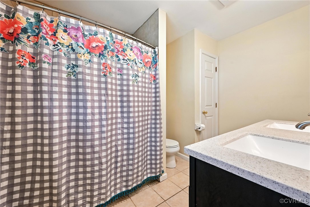 1593 Baxter Road Prince George, VA 23875 - Photo 24 of 48 a bathroom with a sink a vanity and a shower