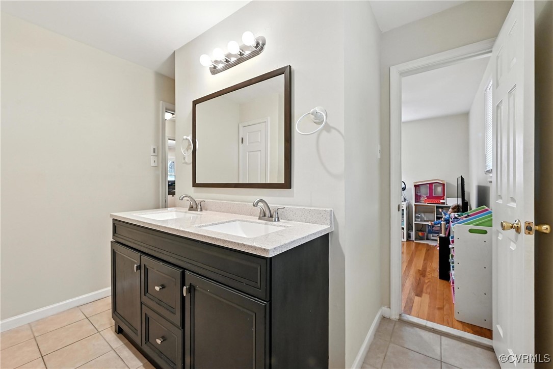 1593 Baxter Road Prince George, VA 23875 - Photo 25 of 48 a bathroom with a sink and a mirror