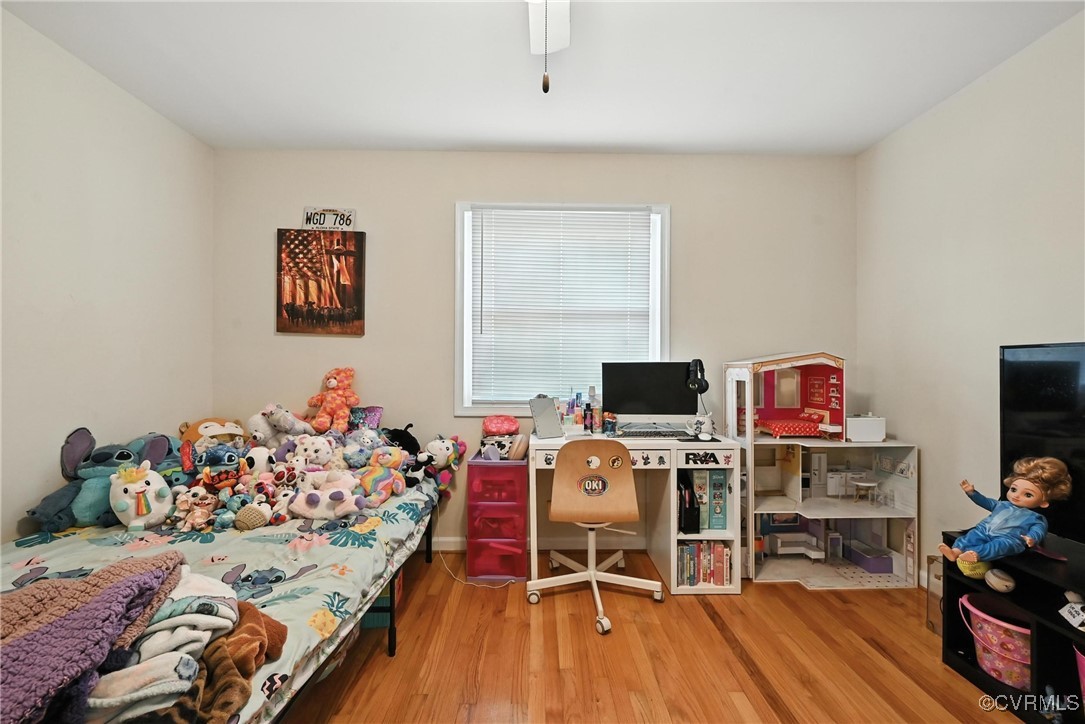 1593 Baxter Road Prince George, VA 23875 - Photo 27 of 48 a bed room with a bed and a tv