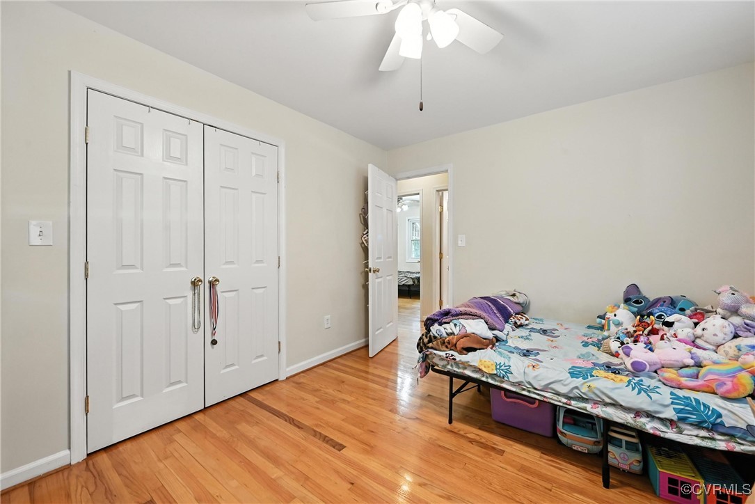 1593 Baxter Road Prince George, VA 23875 - Photo 28 of 48 a bedroom with a bed and a chandelier
