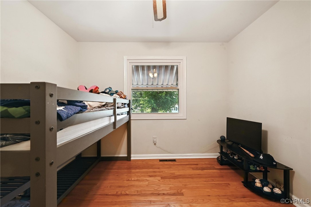 1593 Baxter Road Prince George, VA 23875 - Photo 30 of 48 a living room with furniture and a flat screen tv