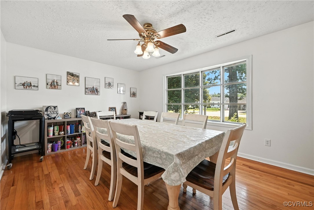 1593 Baxter Road Prince George, VA 23875 - Photo 3 of 48 a dining room with furniture window and wooden floor