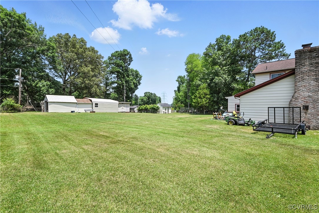 1593 Baxter Road Prince George, VA 23875 - Photo 40 of 48 a view of a house with a yard porch and sitting area