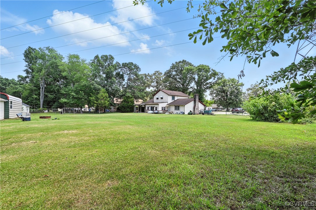 1593 Baxter Road Prince George, VA 23875 - Photo 41 of 48 a view of a garden and basketball court