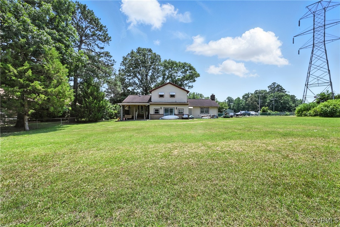 1593 Baxter Road Prince George, VA 23875 - Photo 44 of 48 a view of a green field with wooden fence