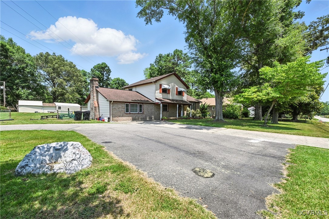 1593 Baxter Road Prince George, VA 23875 - Photo 48 of 48 a front view of a house with garden