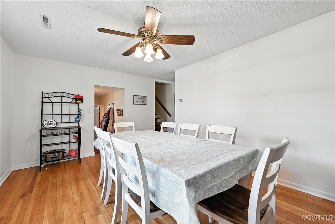 1593 Baxter Road Prince George, VA 23875 - Photo 5 of 48 a view of a dining room with furniture and wooden floor