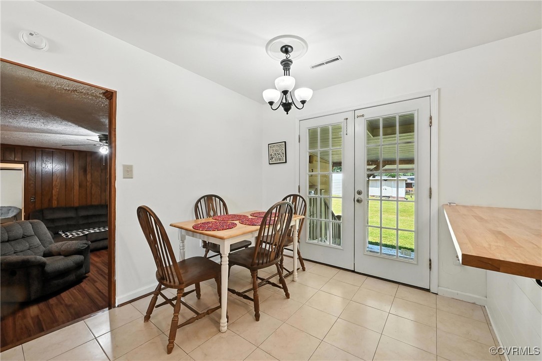 1593 Baxter Road Prince George, VA 23875 - Photo 9 of 48 a view of a dining room with furniture and chandelier