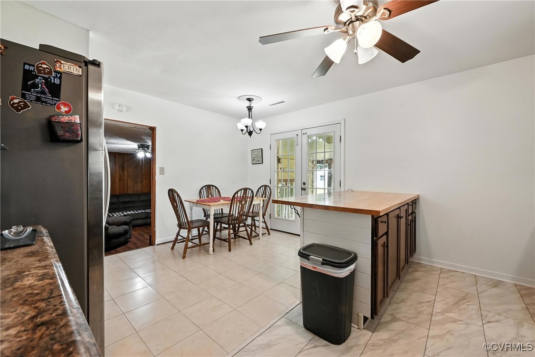1593 Baxter Road Prince George, VA 23875 - Photo 10 of 48 a dining room with furniture and chandelier