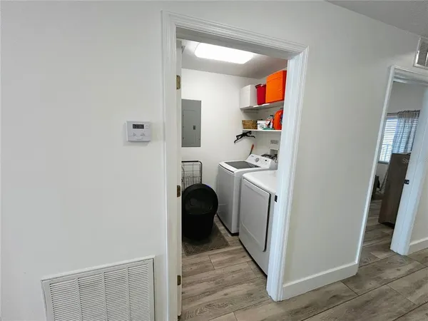 a kitchen with a table and chairs in it