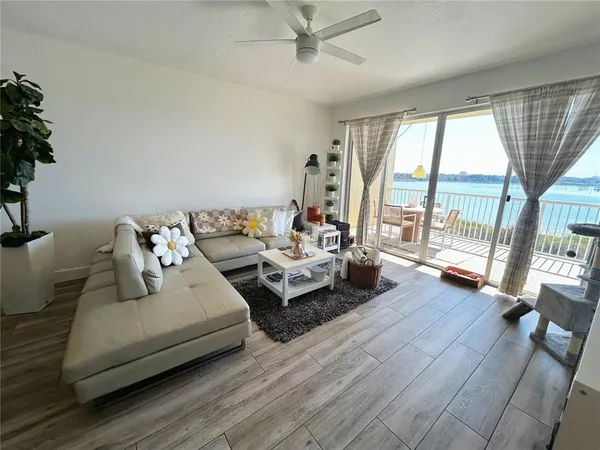 a balcony with table and chairs