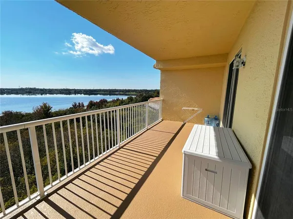 a view of balcony with wooden floor