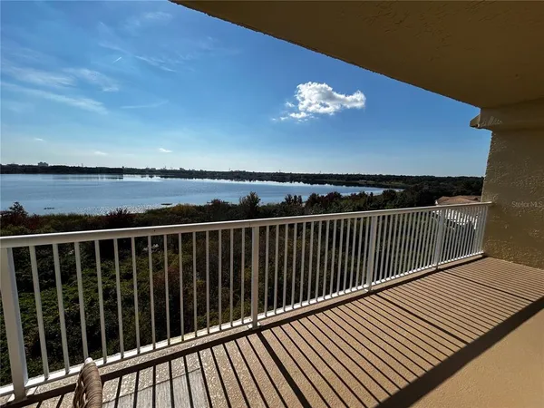 a view of balcony with wooden floor