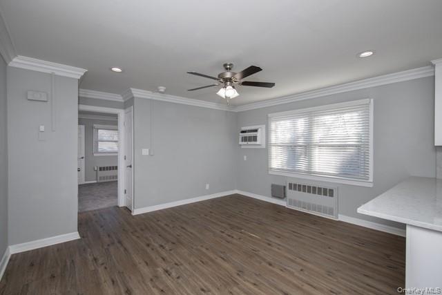 10 Laramie Road, Unit 101 West Babylon, NY 11704 - Photo 6 of 9 an empty room with wooden floor and windows