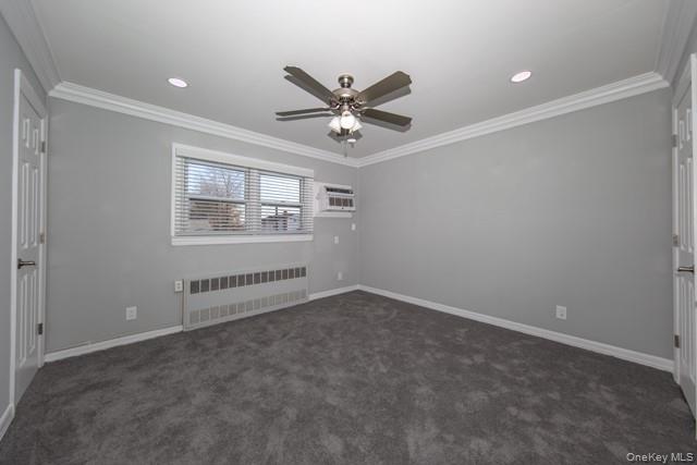 10 Laramie Road, Unit 101 West Babylon, NY 11704 - Photo 7 of 9 an empty room with windows and ceiling fan