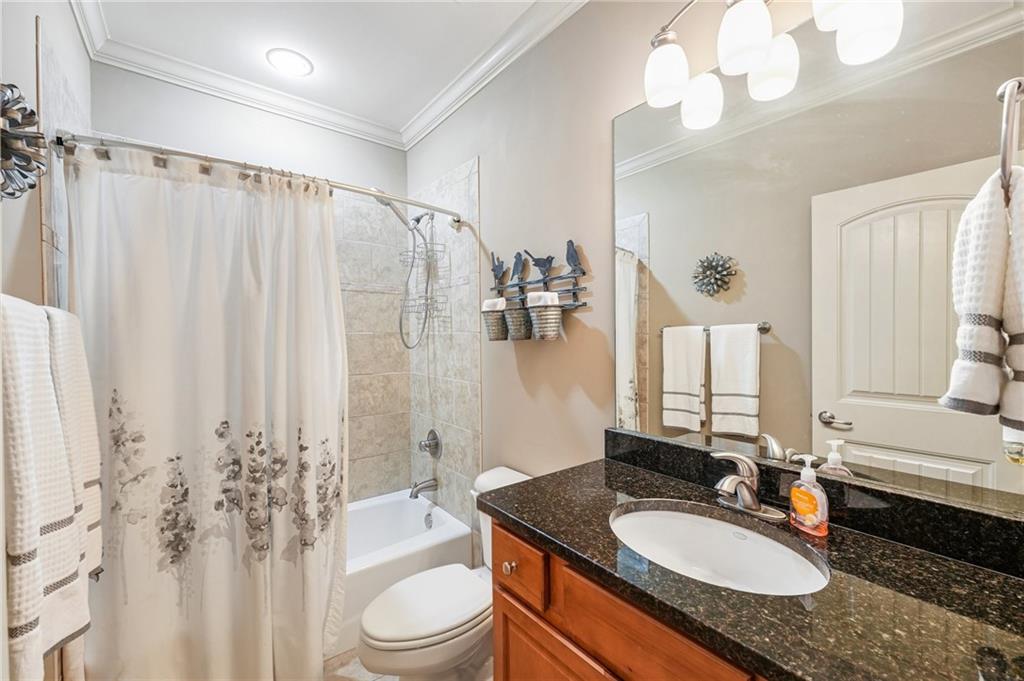 189 Red Trillium Ridge Big Canoe, GA 30143 - Photo 66 of 98 a bathroom with a granite countertop double vanity sink toilet mirror and shower