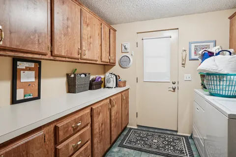 a kitchen with stainless steel appliances granite countertop a refrigerator and a stove