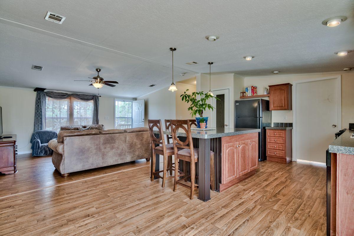 332 Don Graff Road Freeport, FL 32439 - Photo 13 of 33 a living room with furniture and a wooden floor