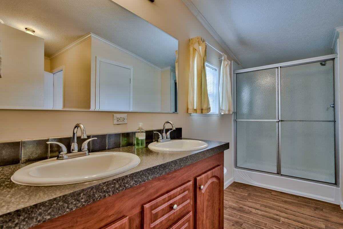 332 Don Graff Road Freeport, FL 32439 - Photo 18 of 33 a bathroom with a sink and a mirror