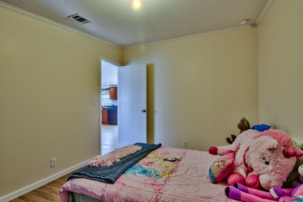 332 Don Graff Road Freeport, FL 32439 - Photo 20 of 33 a bedroom with a bed and a window