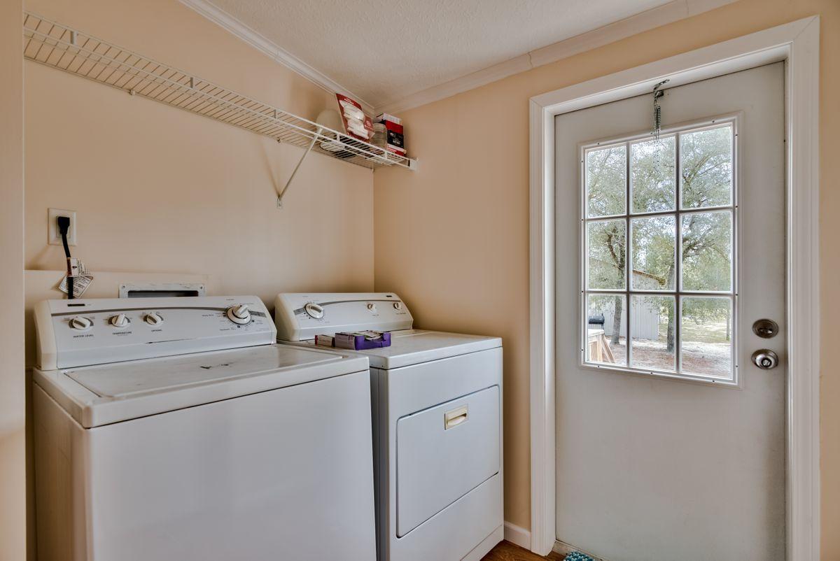 332 Don Graff Road Freeport, FL 32439 - Photo 24 of 33 a utility room with dryer and washer