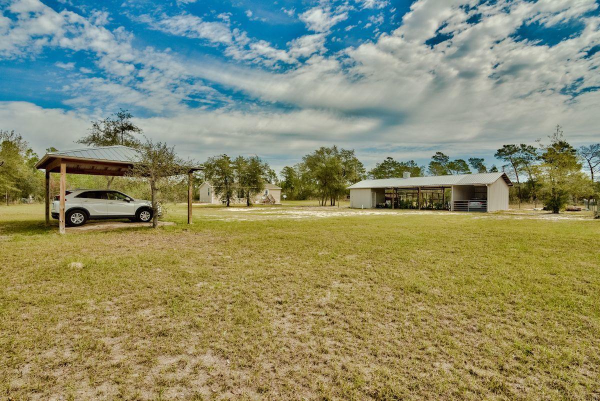 332 Don Graff Road Freeport, FL 32439 - Photo 27 of 33 a car parked on the side of the road