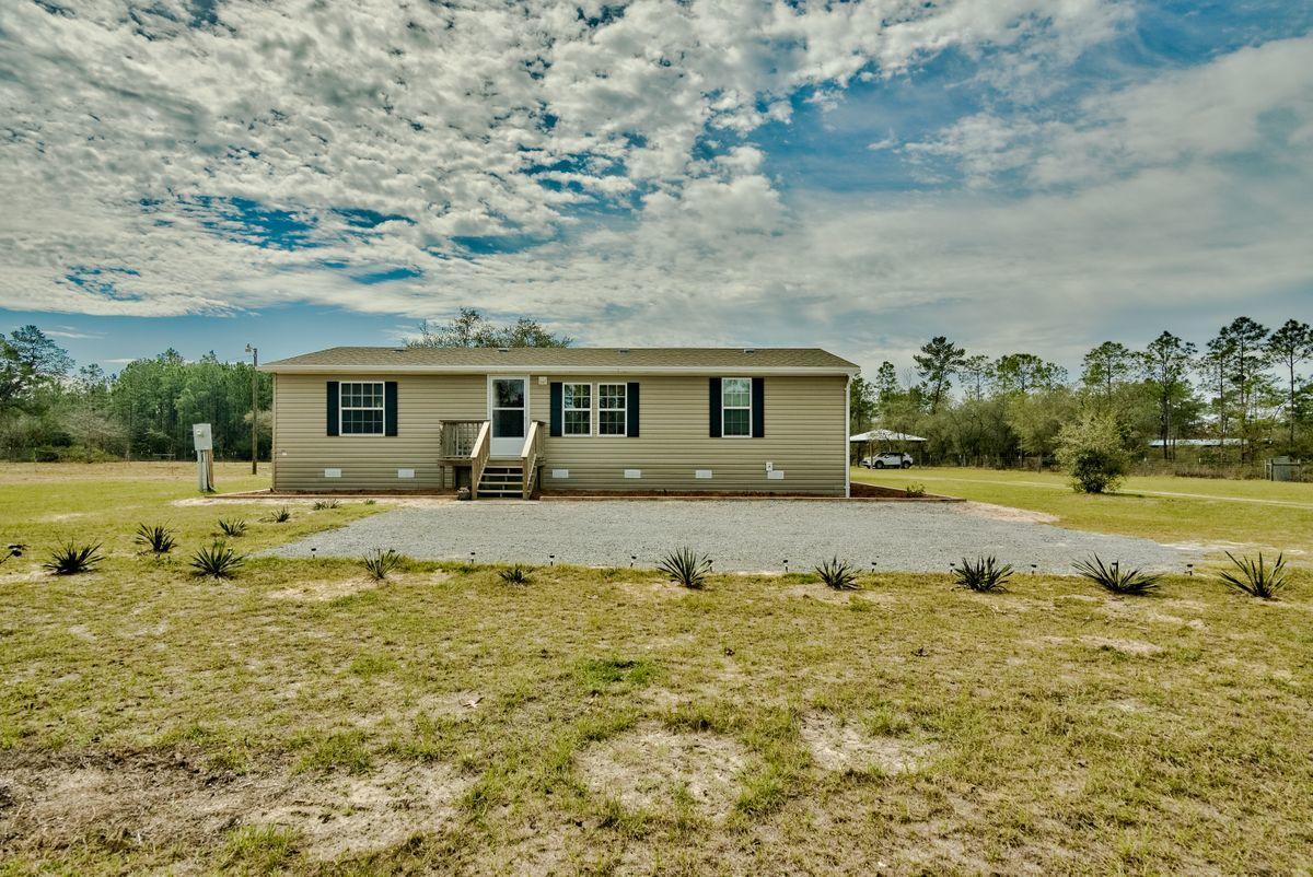 332 Don Graff Road Freeport, FL 32439 - Photo 6 of 33 a view of house with outdoor space and swimming pool