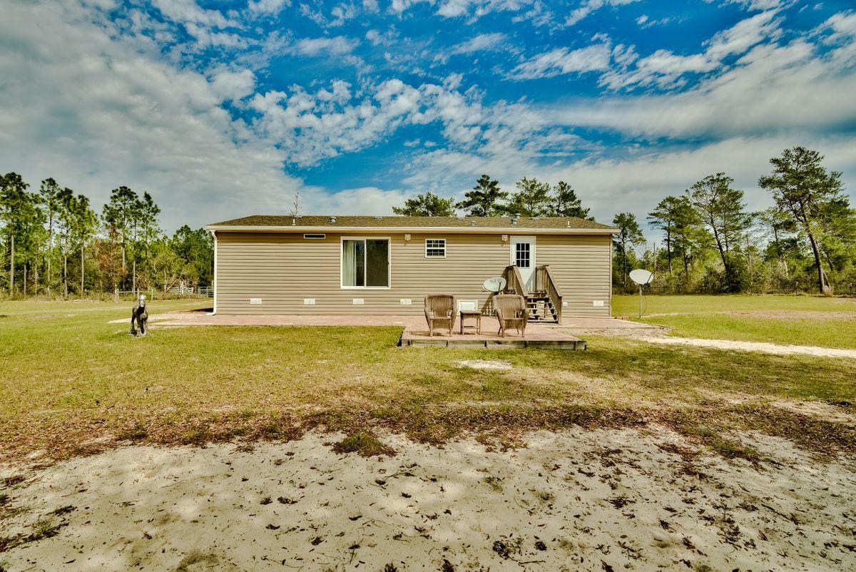 332 Don Graff Road Freeport, FL 32439 - Photo 7 of 33 a front view of a house with garden