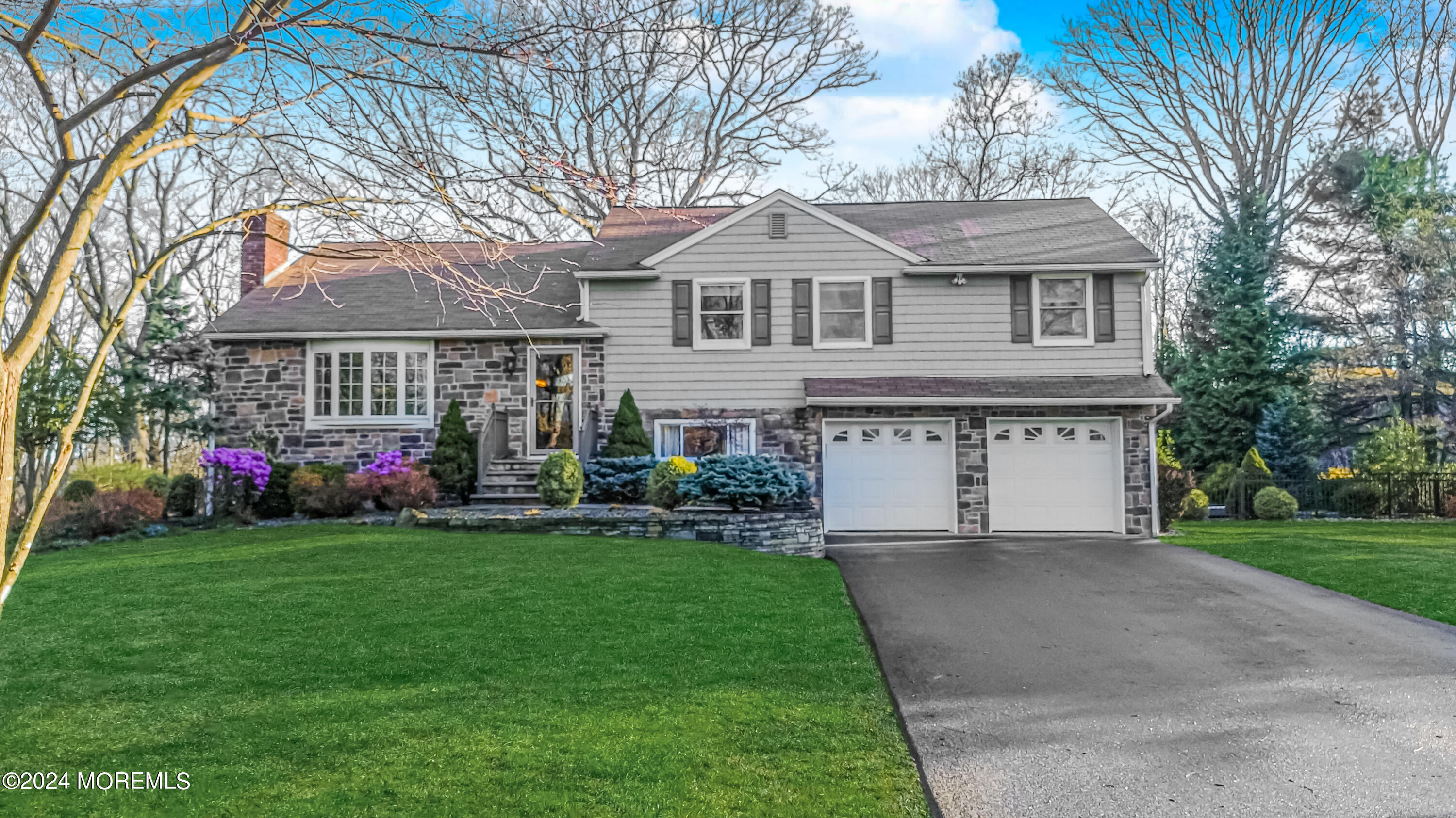 45 Center Road Randolph, NJ 07869 - Photo 2 of 43 a front view of a house with a garden and trees