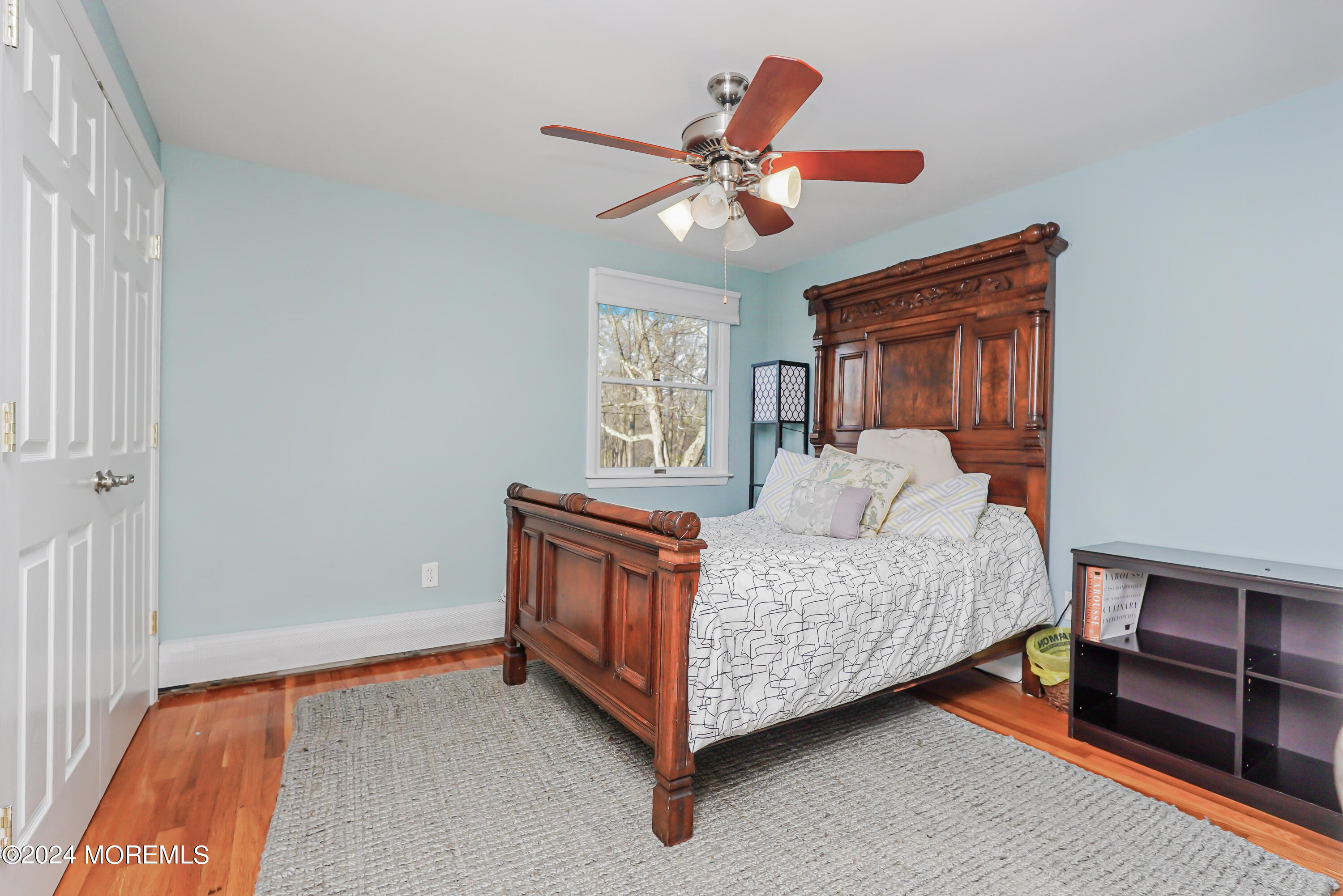 45 Center Road Randolph, NJ 07869 - Photo 25 of 43 a bed room with a bed and a chandelier